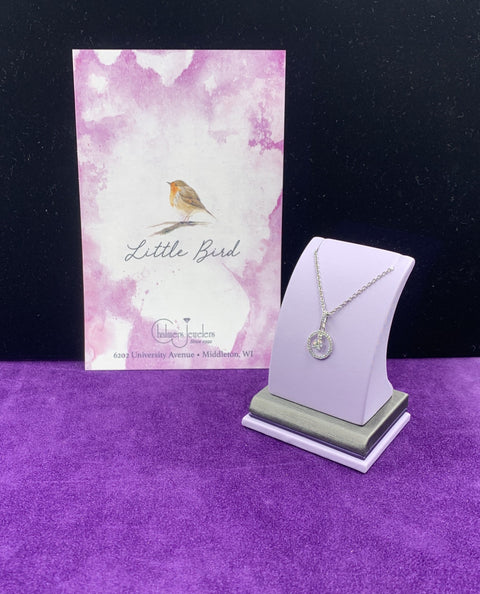 A gorgeous diamonds halo with a center diamond that dangles necklace. - Chalmers Jewelers