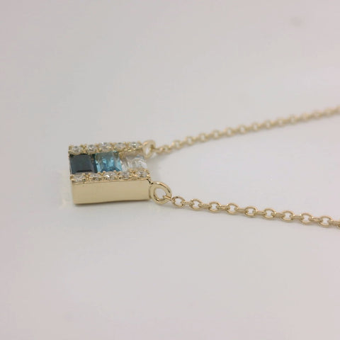 14K Yellow Gold Baguette Blue and White Topaz, Baguette Sapphire, and Diamond Accent Pendant