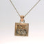 rose gold and silver pendant from a side angle
