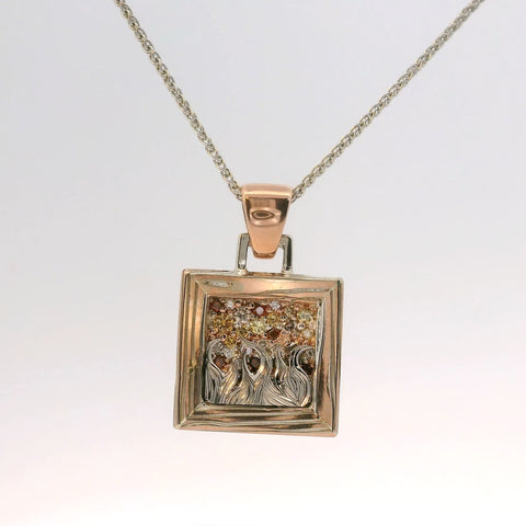 rose gold and silver pendant from a side angle