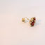 Gold earrings displayed from a different angle