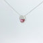 Necklace with a pink gemstone pendant viewed at an angle