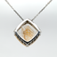 21.14CT RUTILATED QUARTZ AND DIAMOND PENDANT